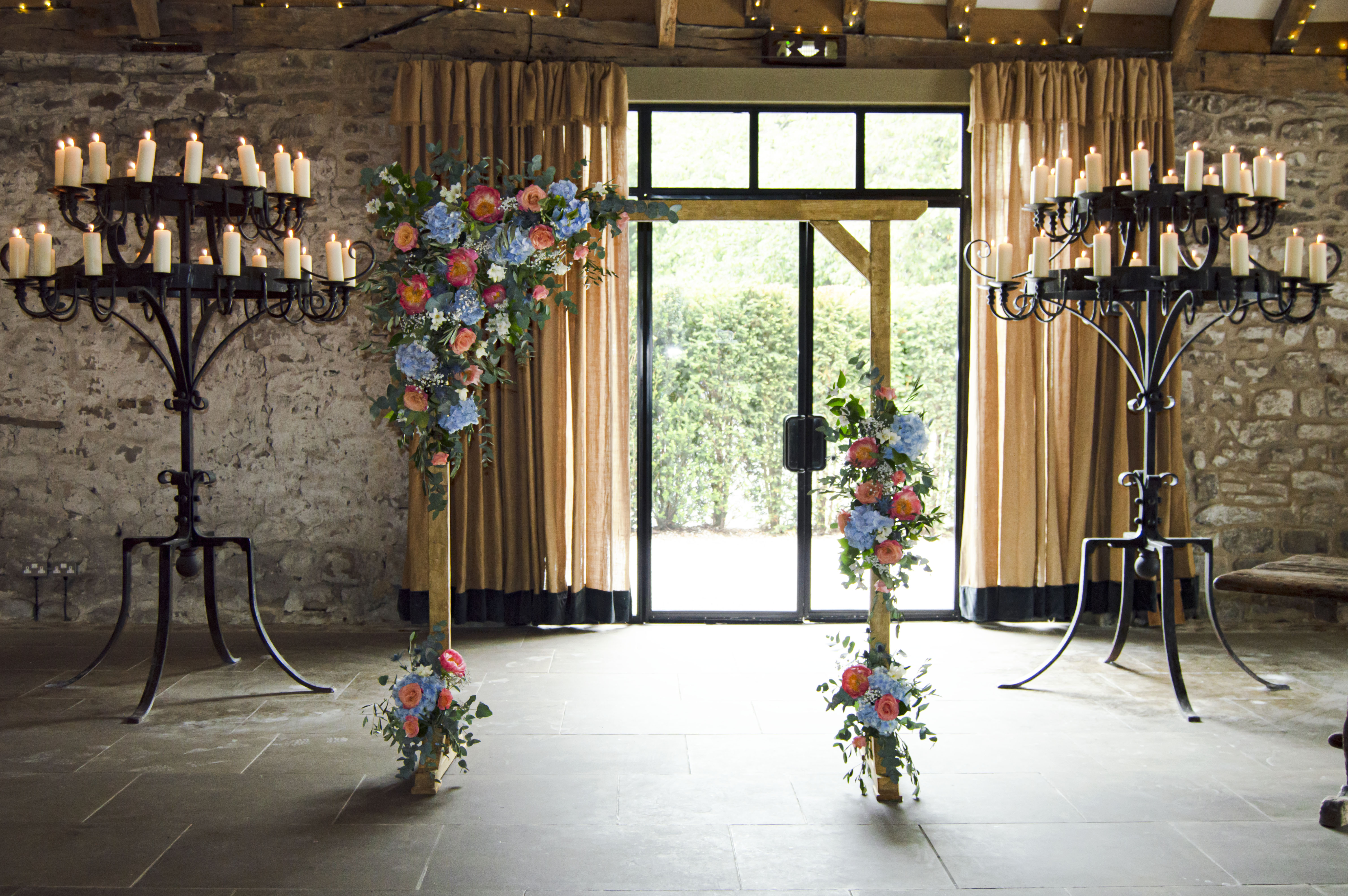 wood-arch-wedding-tithe-barn-blue-coral-ceremony-flowers Grid No Space 5 Columns